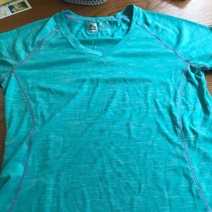 Women’s green athletic shirt.